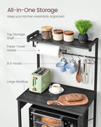 VASAGLE Kitchen Bakers Rack with Power Outlet, Coffee Bar 4-Tier with 8 S Hooks, Microwave Stand, Adjustable Shelf, for Small Spaces, Charcoal Gray and Ink Black UKKS014B01V1