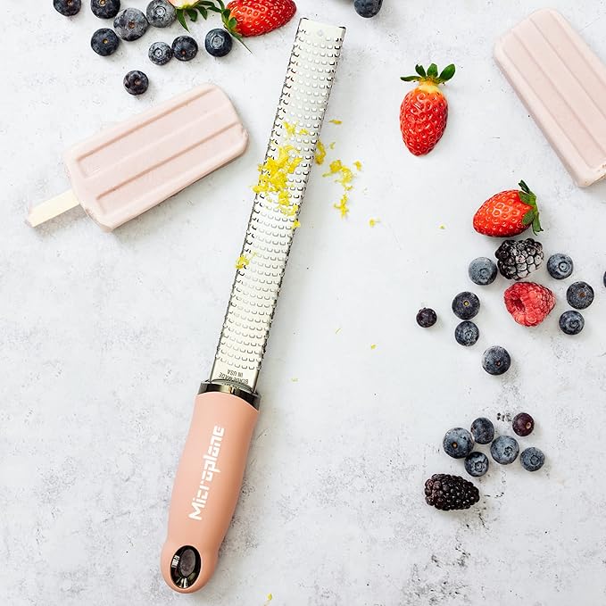 Microplane Zester Grater in Dusty Rose for Citrus Fruits, Hard Cheese, Ginger, Chocolate and Nutmeg with Fine Stainless Steel Blade - Made in USA