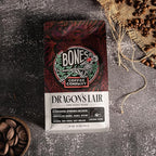 Bones Coffee Company Dragon's Lair, Smokey, Cacao and Caramelized Sugar Notes, Unflavored Coffee, Medium Roast Low Acid Arabica Beans Compatible with Auto drip and French Press Coffee Maker, 12 Oz Ground